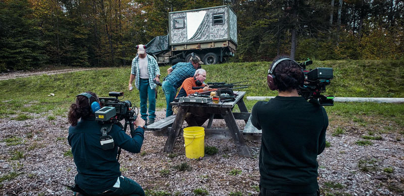 Filmmakers filming on a shooting range in Vermont