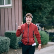 Filmmaker-community Filmmaker making peace sign - "2 Things Every Filmmaker Needs to Survive & Thrive"