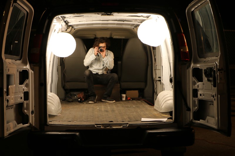 Filmmakers shooting stills photography on set