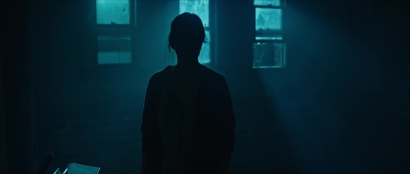 The use of the color cyan in "The Boy Behind the Door"